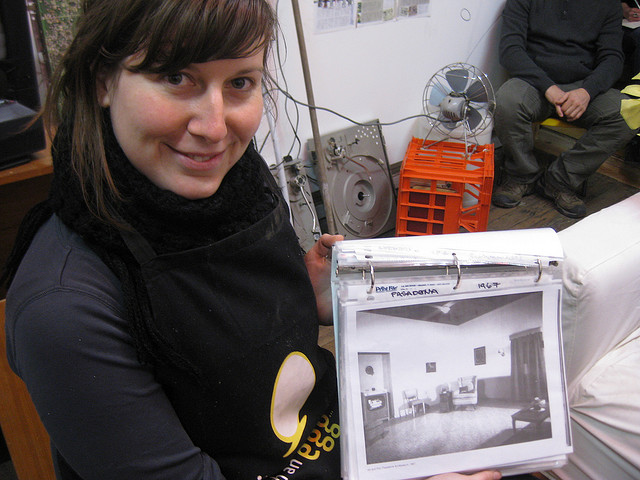 Push and Pull punter Jess Tyrell shows the folder with instructions and documentation of previous Push and Pulls, sent by the Allan Kaprow Foundation